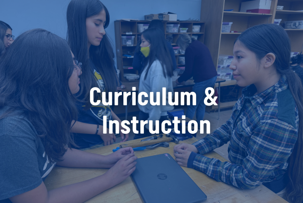 Image of students working on a computer with a label that displays "Curriculum & Instruction" in the center.